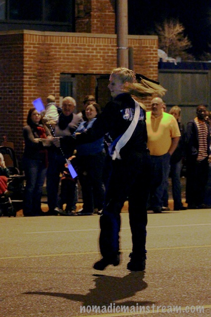 This young woman gave quite a show twirling her baton and tossing it well into the dark.