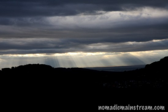 I love light beams peeping through clouds--"god beams" as at least one of my photographer friends calls them.