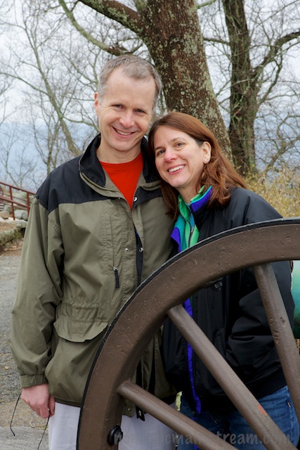 My brother and sister-in-law posing being the wheel of a canon at Point Park