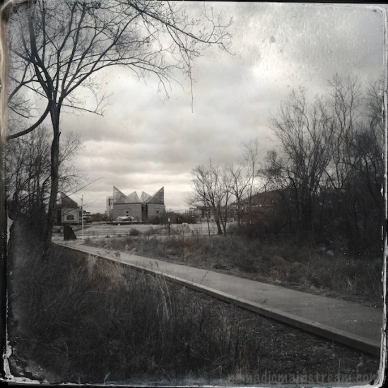 Looking down the walkway in the park and across the river at the Tennessee Aquarium