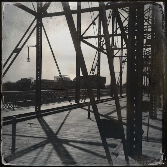 Looking through the bridge trusses toward the bluff and the Hunter Museum