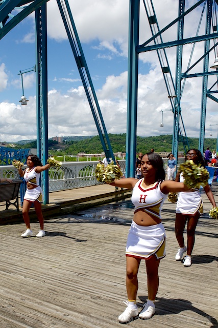 The cheerleaders kept pace with the band