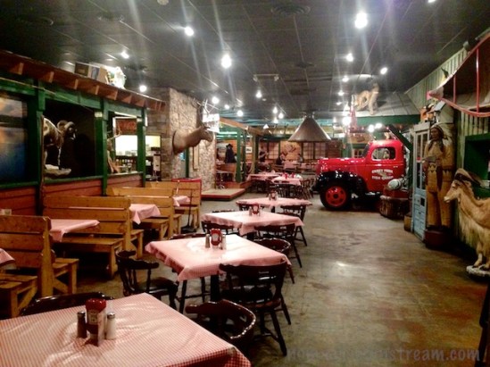 A view of the dining room--including the front of a truck stuck into the wall