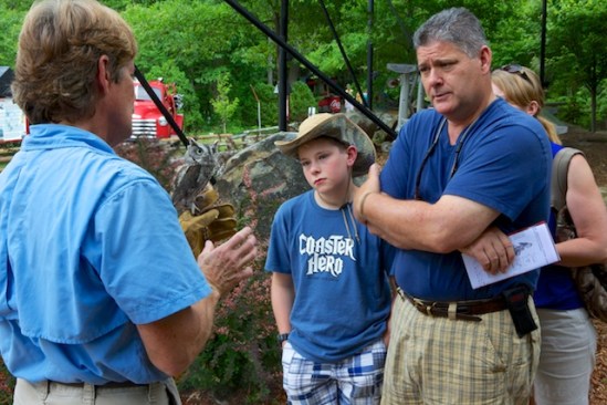A family chats with John after the show, clearly fascinated by the birds
