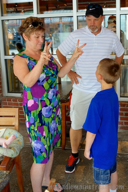 Grandma demonstrating how to make a finger jump from one hand to the other